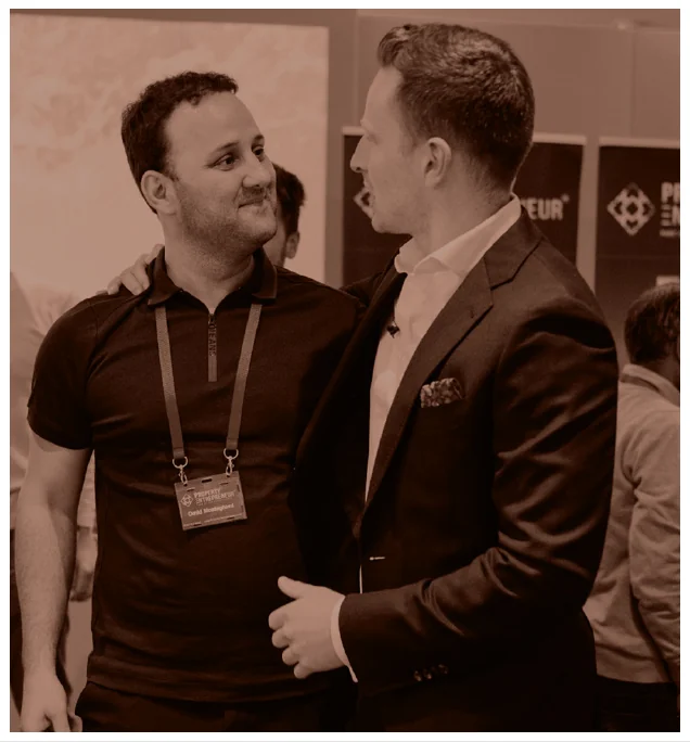 Two Property Entrepreneur members talking at an event